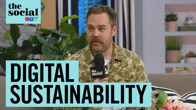 Drew Minns on CTV’s ‘The Social,’ discussing digital sustainability. Drew is holding a microphone branded with ‘The Social’ logo, wearing a camouflage jacket, and is surrounded by plants in a modern studio setting. The text overlay reads ‘DIGITAL SUSTAINABILITY.’