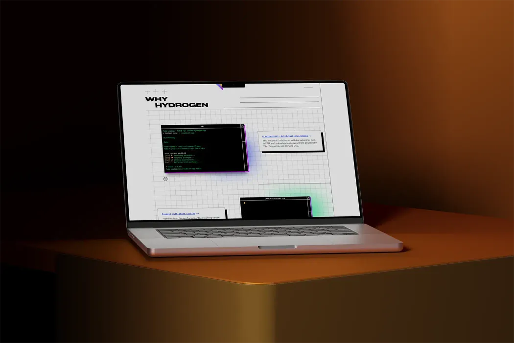 Laptop displaying a webpage titled "Why Hydrogen," featuring code snippets and technical information, set against a dark, warm-toned background.