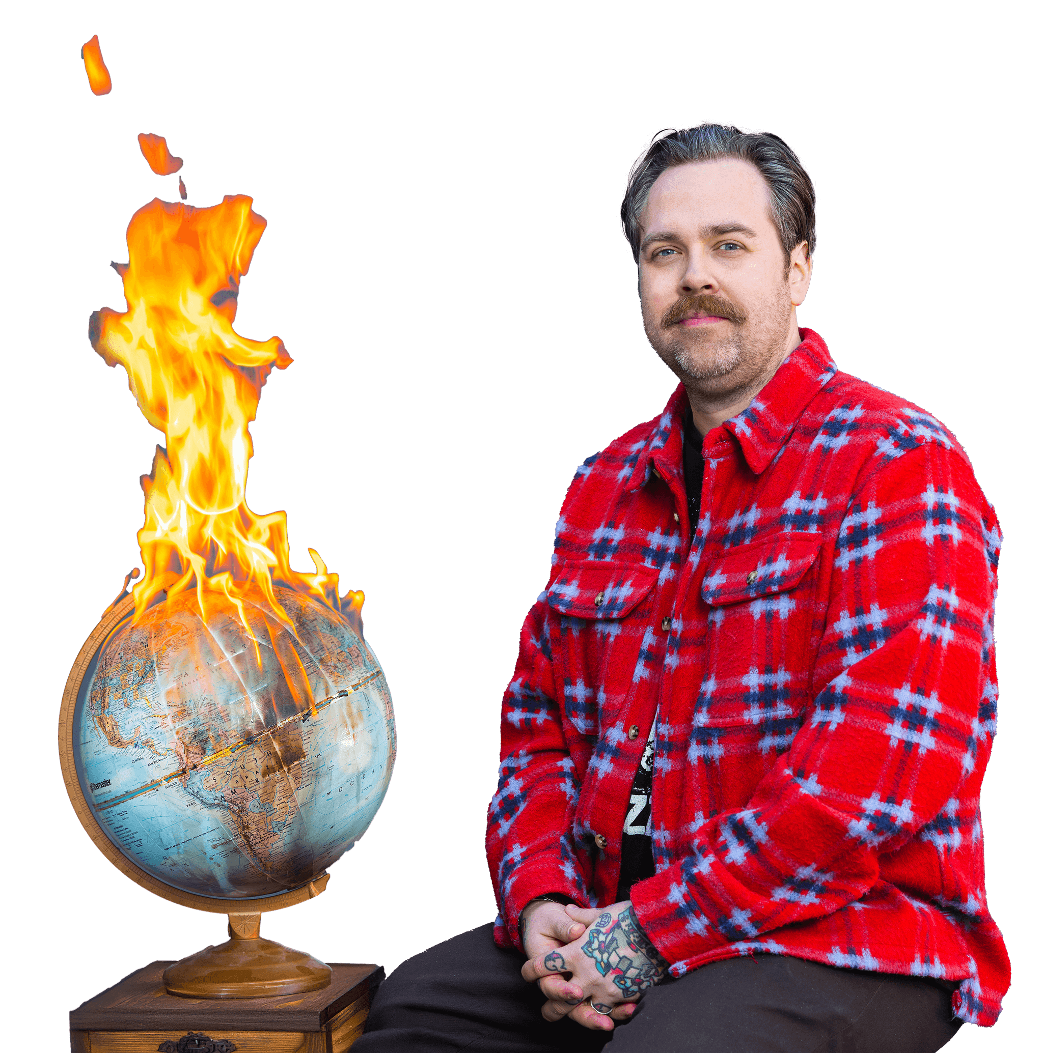 Drew Minns wearing a red plaid jacket sits calmly beside a globe that is dramatically engulfed in flames. He has a mustache, visible tattoos on his hands, and poses against a plain, textured background, creating a striking contrast between composure and crisis.